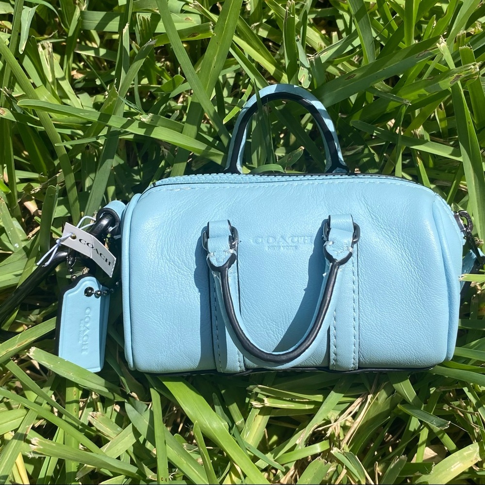 Coach luggage back light blue keychain
